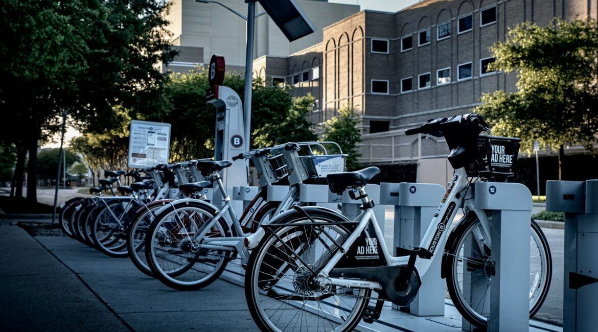 black and silver bicycle parked on sidewalk during daytime